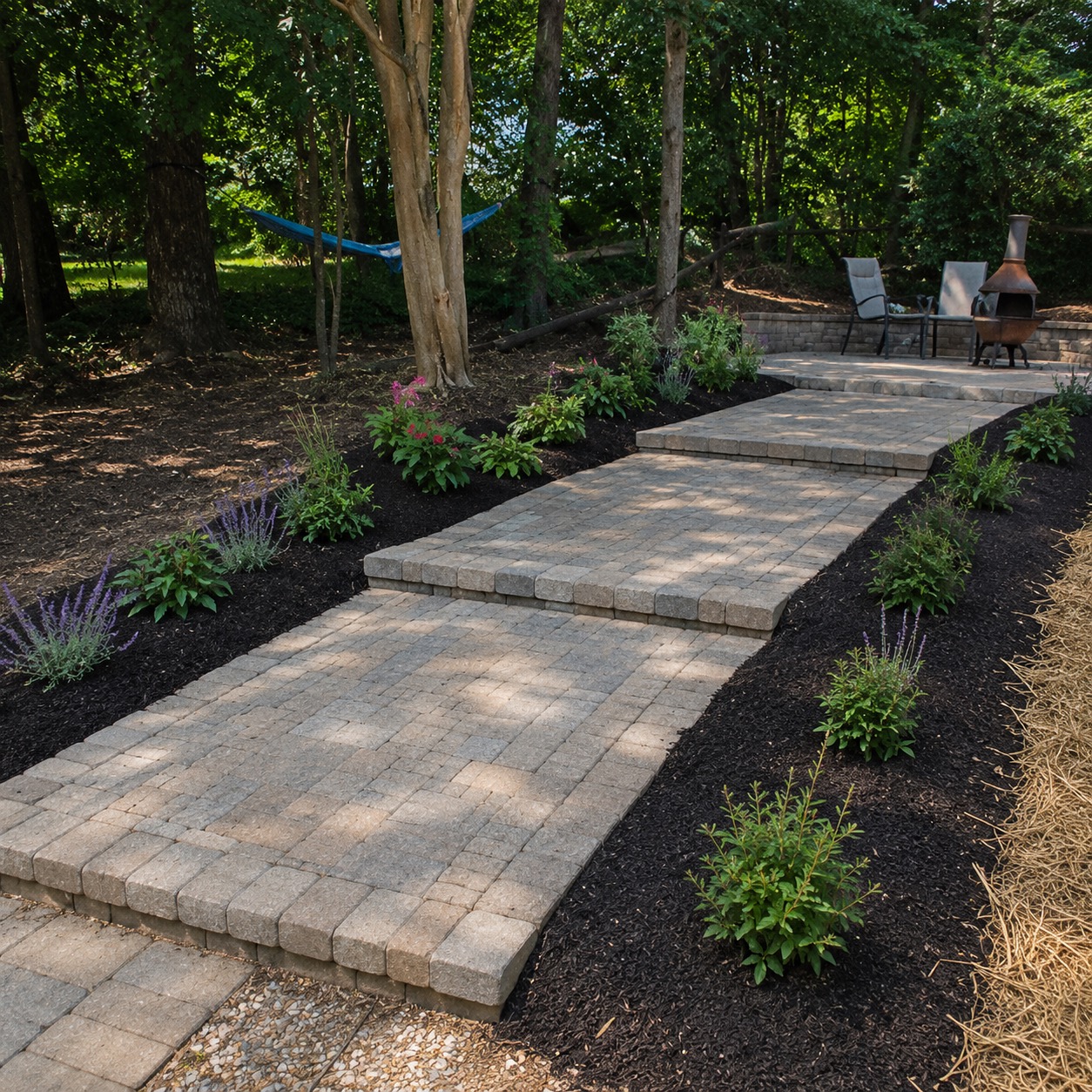 Paver stone steps with fresh mulch beds and lavender plantings — Garrison Landscaping