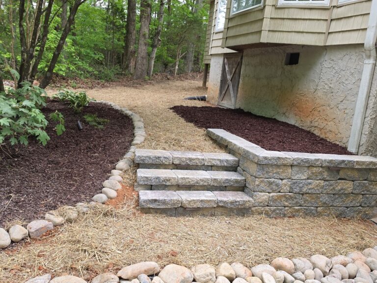 Custom Outdoor Steps & Stairways in Guilford, Rockingham and Surrounding Counties 7 Segmental block garden steps and low seating wall with mulch beds and river rock edging