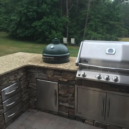 Planning an Outdoor Kitchen in North Carolina: What to Know Before You Build 8 Stone-veneer outdoor kitchen with granite counter, Big Green Egg, stainless grill and storage drawers